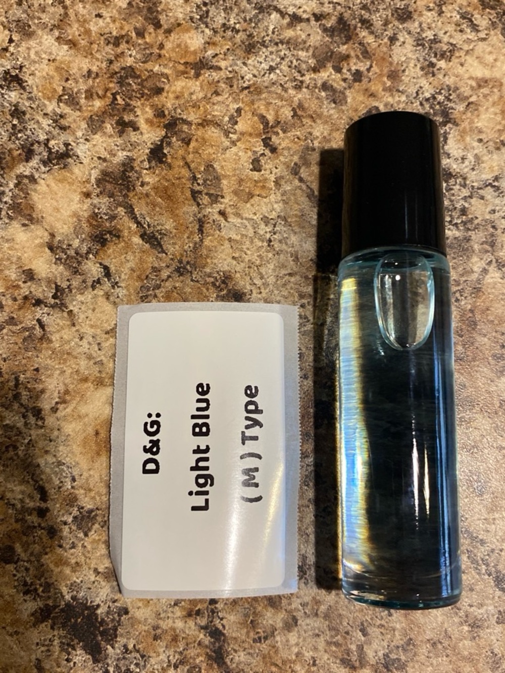 D&G Light Blue Roller Bottle - Black Cap with Light Blue Glass